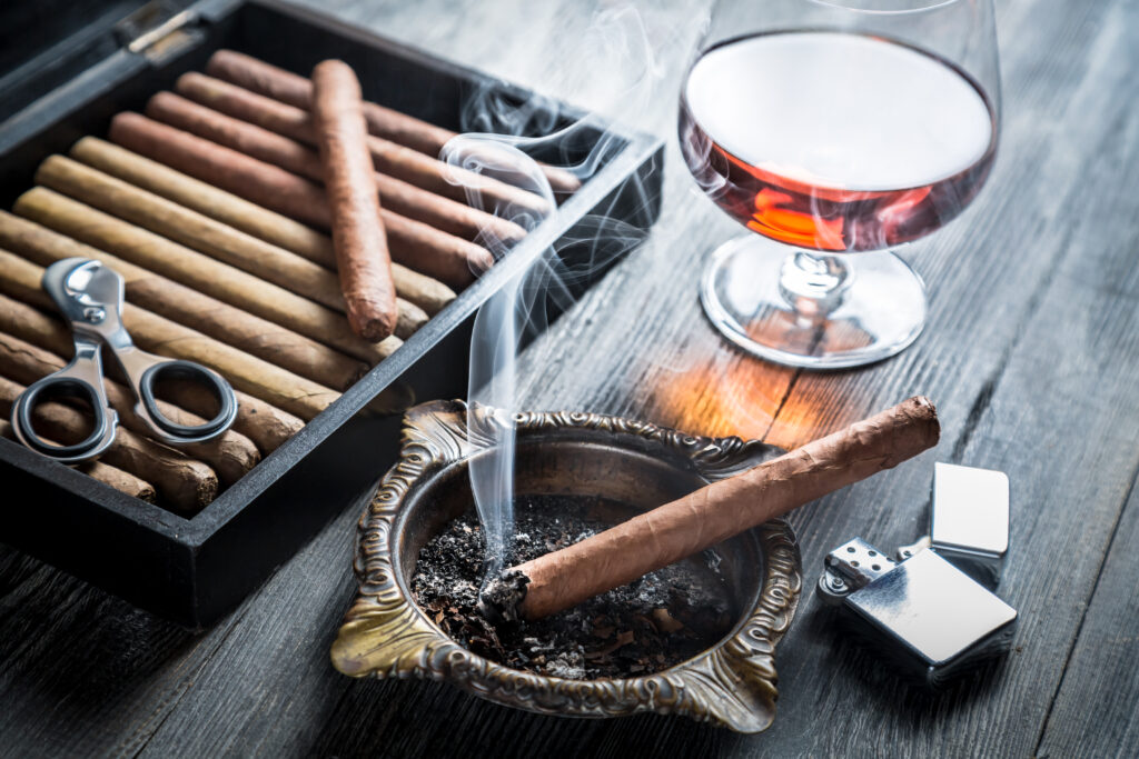 Taste of cognac and cigar fuming